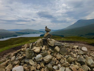man on top of mountain