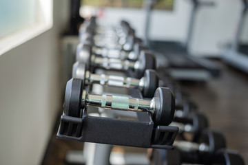 Obraz na płótnie Canvas Dumbbells in gym. Close up many dumbbells in sport fitness centre.