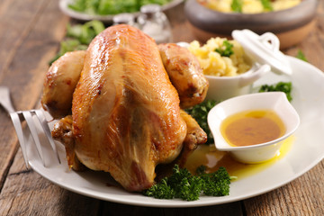 baked chicken with mashed potato and sauce