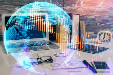 Multi exposure of chart and financial info and work space with computer background. Concept of...