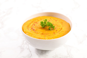 bowl of soup with spices and herbs