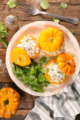 stuffed pumpkin with rice and salad, top view