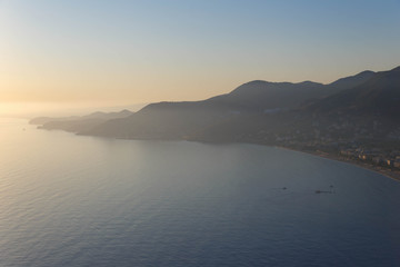 Fototapeta na wymiar Scenic sunset over the mountainous coast of the Mediterranean sea.