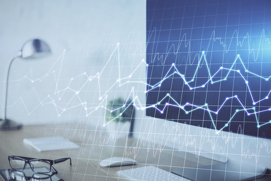 Financial graph colorful drawing and table with computer on background. Double exposure. Concept of international markets.