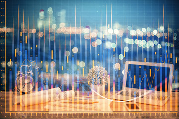 Double exposure of graph and financial info and work space with computer background. Concept of...