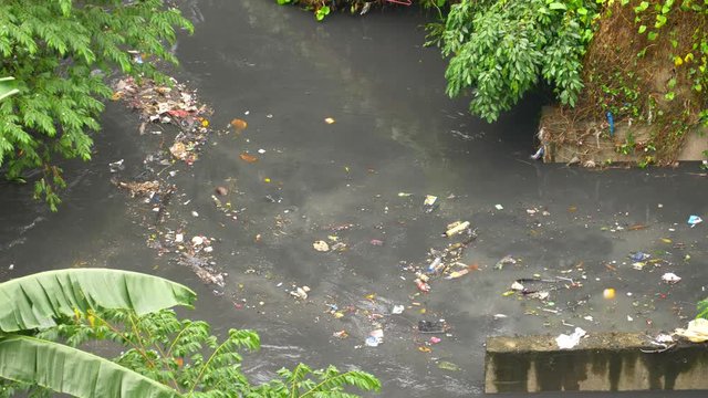 Dirty River covered in Trash in the Philippines 4K