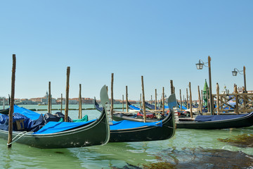 Fototapeta na wymiar Gondolas parked close to San Marco Square in Venice, Italy