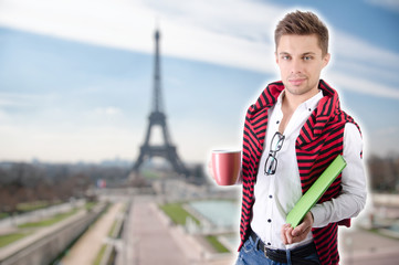 Young attractive student. Tablet and study.