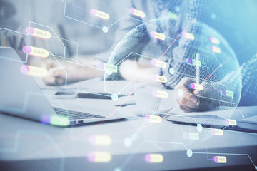 Multi exposure of world map hologram with man working on computer on background. Concept of worldwideweb.