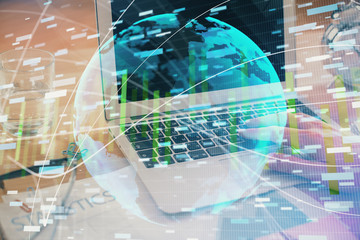 Multi exposure of businessman working on laptop on background. International business hologram in front. Concept of success.