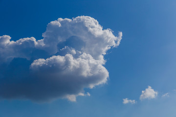 Naklejka na ściany i meble Fluffy beautiful clouds on a background of blue sky