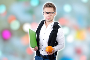 Young attractive student. Tablet and study.