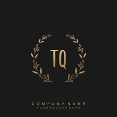 letter TQ surrounded by beautiful and elegant flowers and leaves. Wedding monogram logo template.