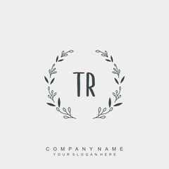 letter TR surrounded by beautiful and elegant flowers and leaves. Wedding monogram logo template.