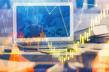 Double exposure of forex chart and work space with computer. Concept of international online trading.