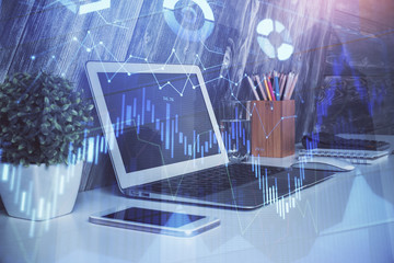 Financial graph colorful drawing and table with computer on background. Double exposure. Concept of international markets.