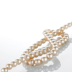 pearl necklace on white background.