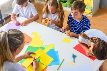 Preschool Teacher with Children at Kindergarten - Creative Art Class
