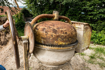 old and rusty mixer for concrete