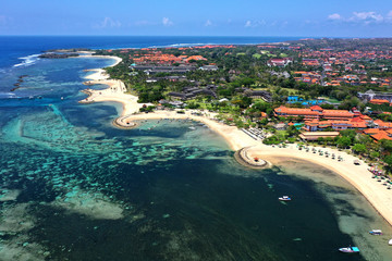 Beautiful drone view of white sand beach and resorts of Tanjung Benoa Bali.