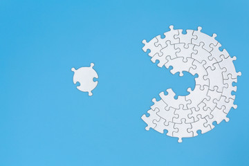 Unfinished white jigsaw puzzle pieces on blue background, The last piece of jigsaw puzzle, Copy...