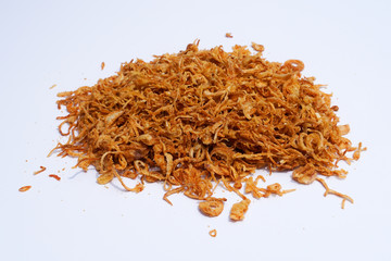 Fried onions or crispy fried onion flakes isolated on white background