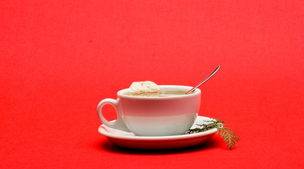 Herbal or green tea. Ceramic cup hot fresh brewed tea beverage. Health care folk remedies. Warm winter beverage. Cafe restaurant menu. Cup of tea on red background close up. Gourmet delicious taste