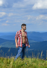 Hiking concept. Power of nature. Man unbuttoned shirt stand top mountain landscape background. Muscular tourist walk mountain hill. Strong hiker muscular torso. Athlete muscular guy relax mountains