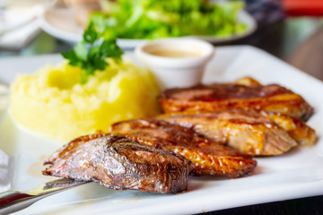 juicy steak beef meat with potatoes