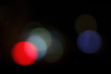 Colored abstract bokeh on black background