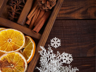 Christmas holiday composition : Beautiful close-up  of dry Oranges, white snowflakes, Cinnamon...