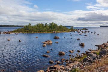 View of the Gulf of Bothnia with numerous boulders at the coast and islets overgrown with the forest, Northern Finland.