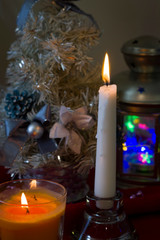 Happy new year 2020.Christmas decorations with Christmas fir candles on the background of lights and tinsel and Christmas balls.