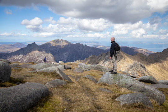 man standing at the top of goat fell on arran