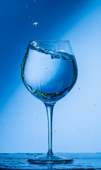 glass, wine, drink, water, alcohol, wineglass, blue, isolated, empty, white, liquid, transparent, clear, beverage, clean, object, crystal, goblet, reflection, drop, bar, single, fresh, cold, celebrati