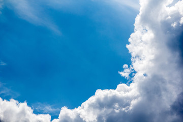 cumulus clouds against a blue sky