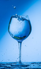 glass, wine, drink, water, alcohol, wineglass, blue, isolated, empty, white, liquid, transparent, clear, beverage, clean, object, crystal, goblet, reflection, drop, bar, single, fresh, cold, celebrati