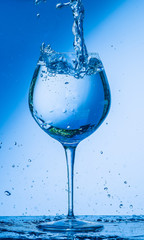 glass, wine, drink, water, alcohol, wineglass, blue, isolated, empty, white, liquid, transparent, clear, beverage, clean, object, crystal, goblet, reflection, drop, bar, single, fresh, cold, celebrati