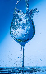glass, wine, drink, water, alcohol, wineglass, blue, isolated, empty, white, liquid, transparent, clear, beverage, clean, object, crystal, goblet, reflection, drop, bar, single, fresh, cold, celebrati
