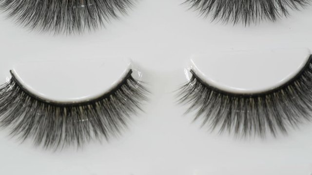 A number of unused false eyelashes in a special box close up view