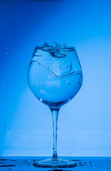 glass, wine, drink, water, alcohol, wineglass, blue, isolated, empty, white, liquid, transparent, clear, beverage, clean, object, crystal, goblet, reflection, drop, bar, single, fresh, cold, celebrati