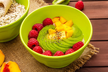 Oatmeal bowl with fresh berries and fruits