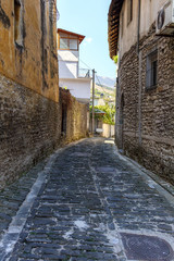 Fototapeta na wymiar Narrow street in the old part of Gjirokastra, Albania
