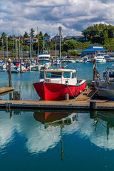 Fototapeta na wymiar An old Red Fishing Boat in Marina in Bellingham, Washington