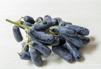 A bunch of ripe gold-fingered hetty grapes