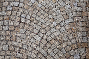 old street path paved with stones in the form of a mosaic