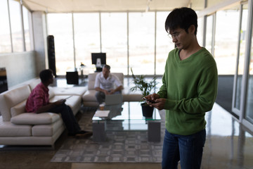 Male executive using mobile phone in office