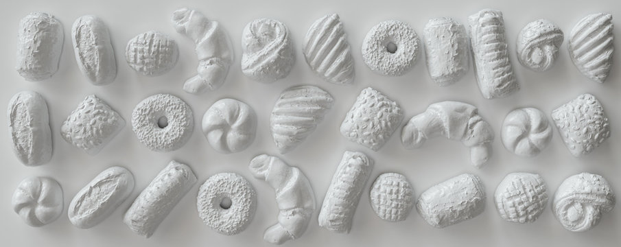 White painted pastry pieces on white background - 3D Rendering