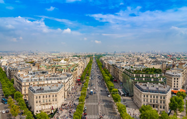 Lovely panoramic aerial view of the famous Avenue des Champs-Élysées in Paris on a nice sunny day with a blue sky at the horizon. It is one of the most recognisable avenues in the world. - obrazy, fototapety, plakaty