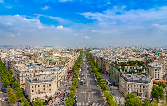 Lovely panoramic aerial view of the famous Avenue des Champs-&Eacute;lys&eacute;es in Paris on a nice sunny day with a blue sky at the horizon. It is one of the most recognisable avenues in the world.
